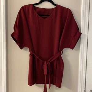 Maroon color top with a tie around waist size s